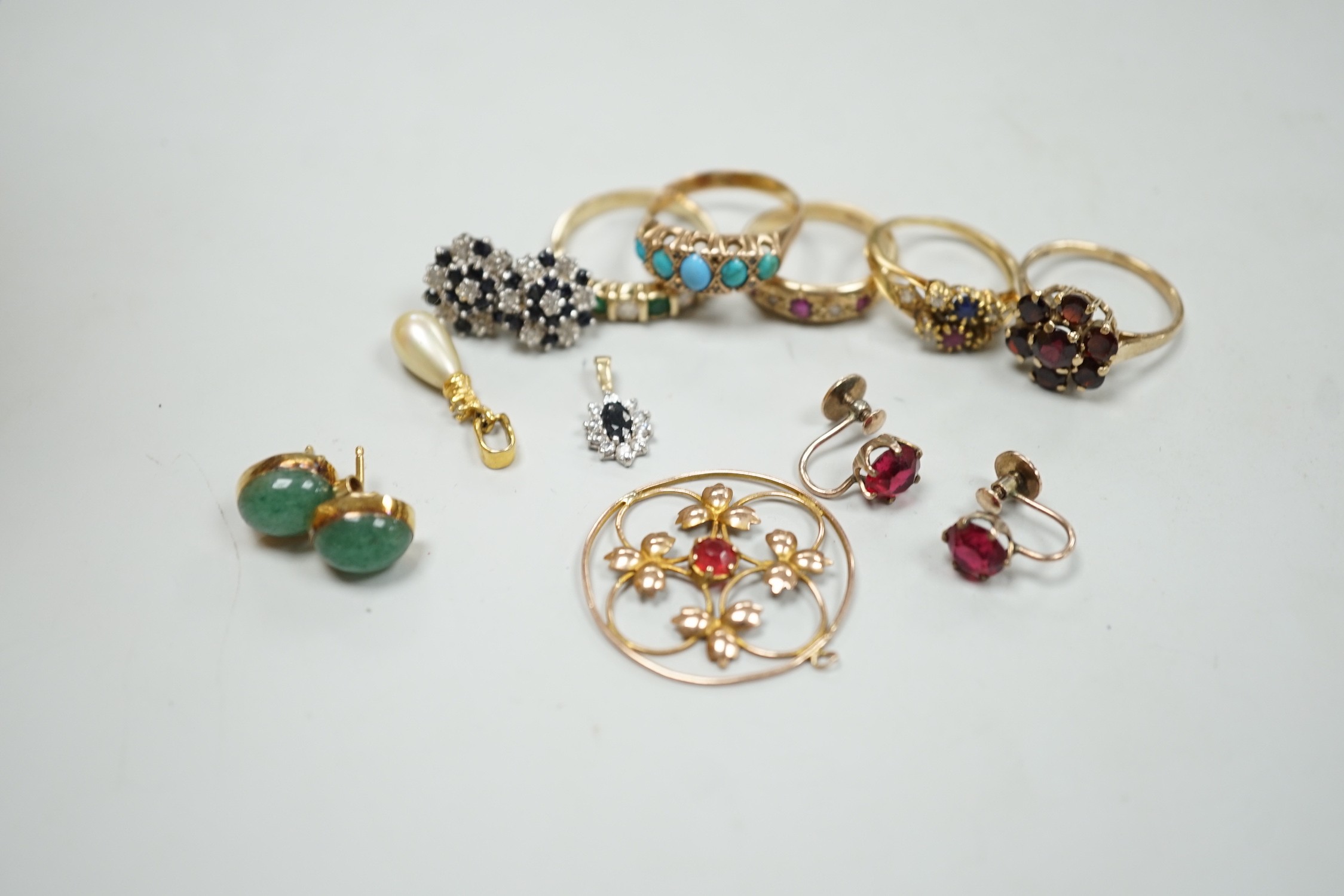 Five assorted 9k and gem set rings including ruby and diamond gypsy set and other jewellery.